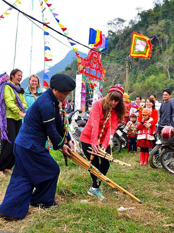 Cultural exchange between tourists and local people at the festival