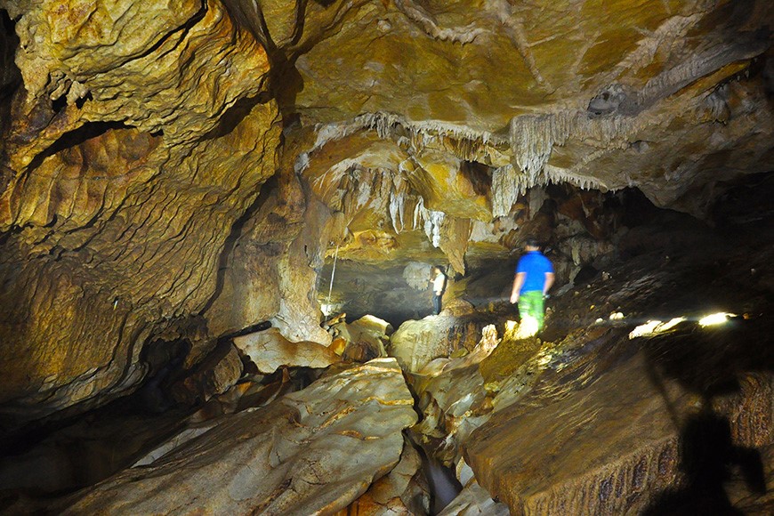 After the sump, a massive cave with rock formations