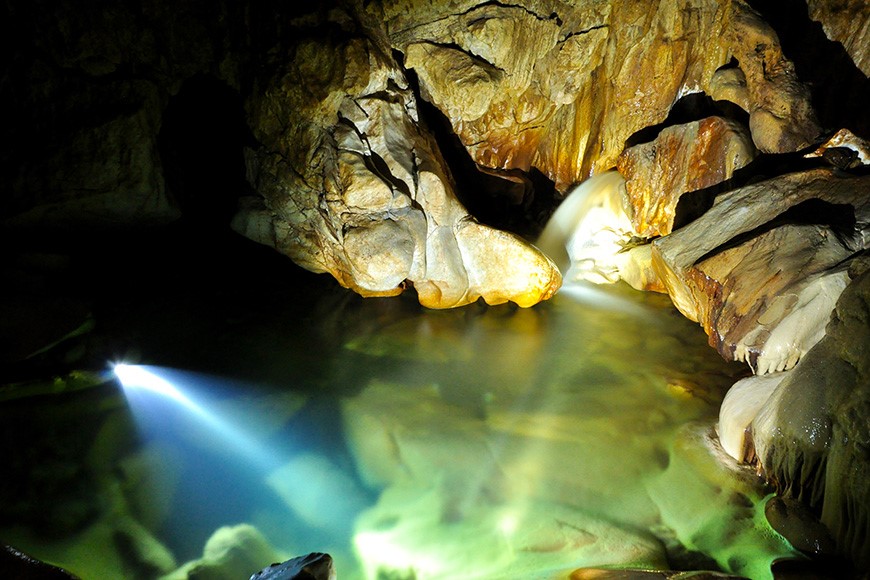 A stream flows inside the cave to the upstream